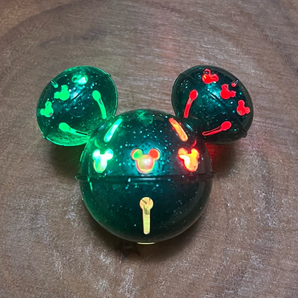 Disney Parks 2023 Holiday Christmas Mickey Jingle Bell green Glow glitter Cube.